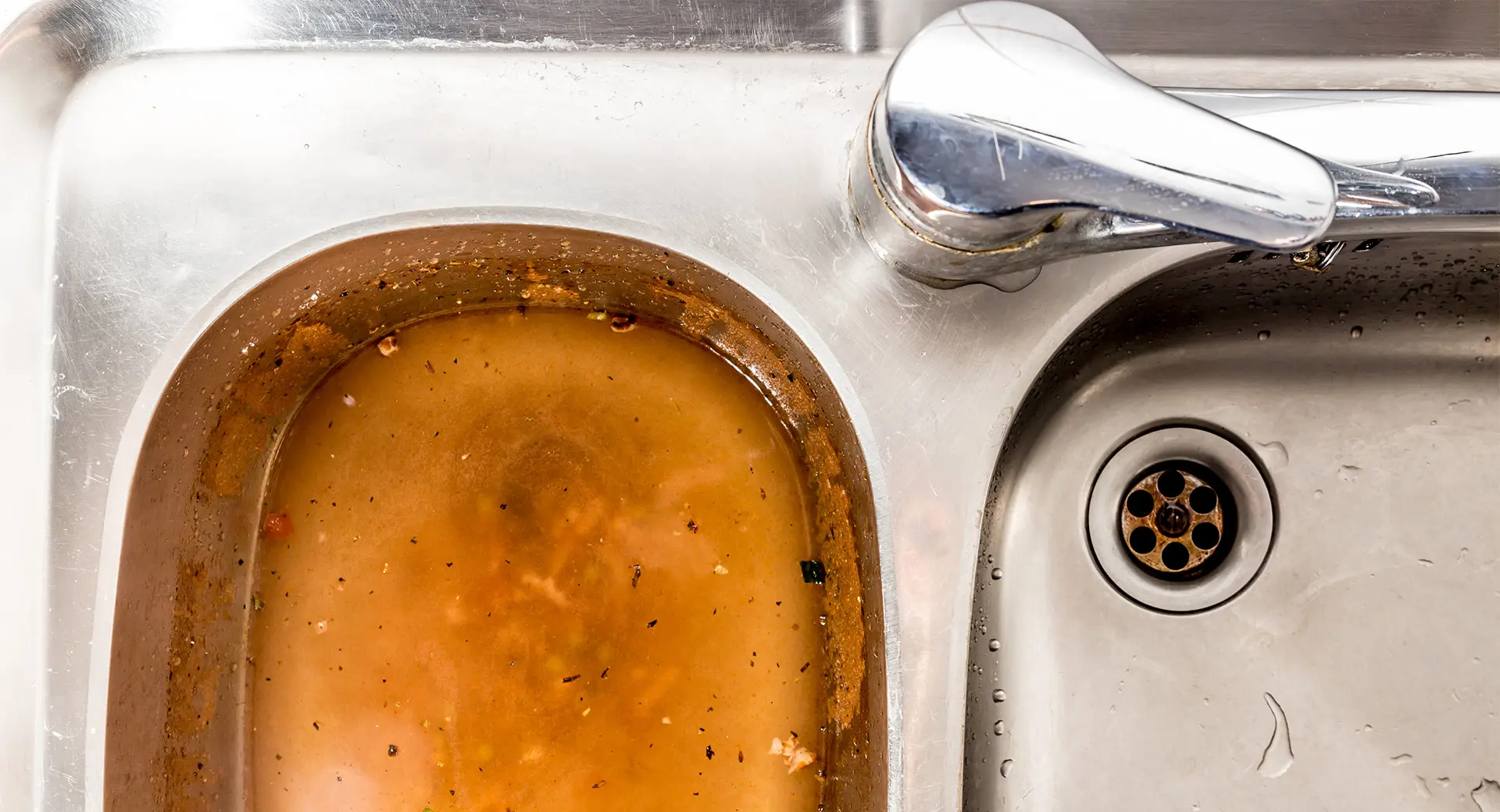 A sink that is blocked with food